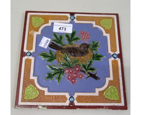 Late 19th / early 20th Century Minton & Co. coloured tile, decorated in high relief with a blackbird in a nest, 20cms square 