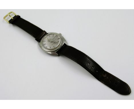 Omega Constellation wristwatch, the stainless steel case with a silvered dial, baton numerals, sweep seconds hand and day / d