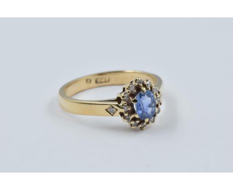 9ct Gold oval sapphire and diamond cluster ring, size 'K', 2.5g 