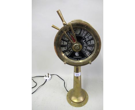Novelty lamp in the form of a ships capstan in brass, 50cms high 