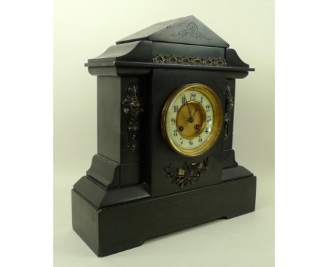 A Victorian slate mantel clock of architectural from, engraved decoration and applied metal castings, the cream and metal dia