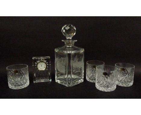 A Waterford crystal clock, 12cm, an Edinburgh crystal decanter, 25cm, boxed, and four Tyrone Crystal tumblers, hand made in I