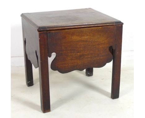 An early Georgian mahogany commode, with lift surface revealing a ceramic bowl and circular wooden lid, shaped apron and rais