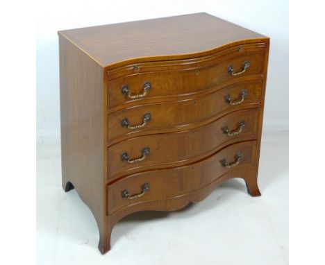 A mahogany, crossbanded and line inlaid serpentine fronted chest of four graduating drawers, mid to late 20th century, in the