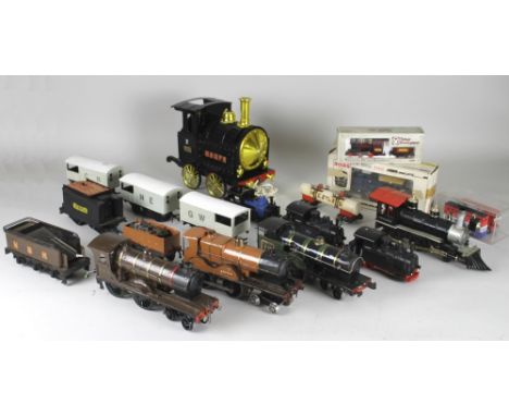 A mixed lot of model trains and rolling stock, including three O gauge clockwork kit built locos, a Paya electric toy Renfe t