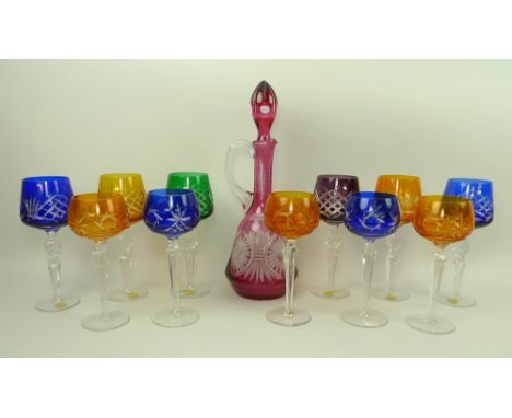 A Bohemian ruby flashed glass decanter and stopper, 37cm, together with a set of six coloured glass hock glasses with tall st
