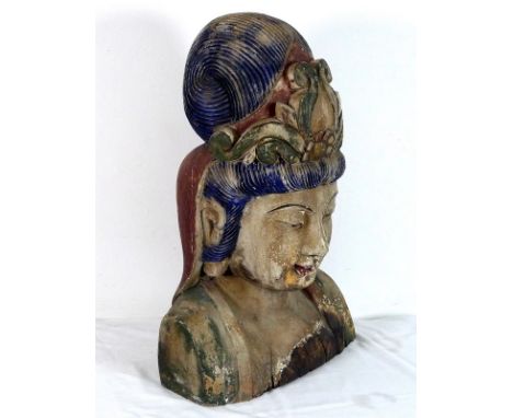 A large Buddhist head and shoulders, the bust of Guanyin Bodhisattva carved from a single hardwood trunk, painted blue and gr