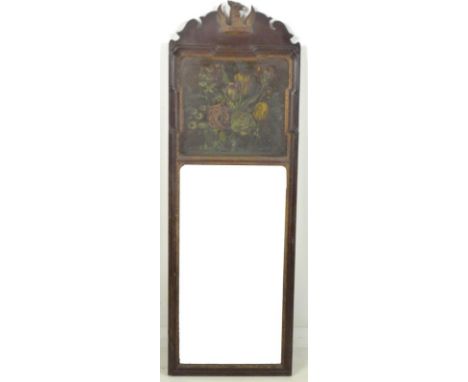 An Edwardian pier mirror with painted armorial crest to the fretwork pediment, below a floral painted panel with moulded fram
