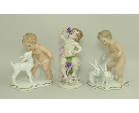 A pair of Wallendorf porcelain figures of Putti, one with a lamb, number 1380, the other with rabbits, number 1183, 16cm, tog