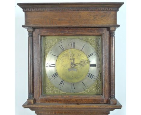 A George III oak long case clock, 30 hour movement with anchor escapement, striking on a bell, 10 inch brass dial engraved wi