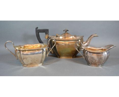 A George VI Sheffield Silver Tea Set comprising of teapot, cream jug and sucrier of shaped tapering form Sheffield 1937, make