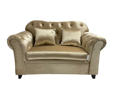 Chesterfield shaped snuggler sofa, upholstered in buttoned champagne fabric, with scatter cushionsDimensions: Height:&nbsp;89