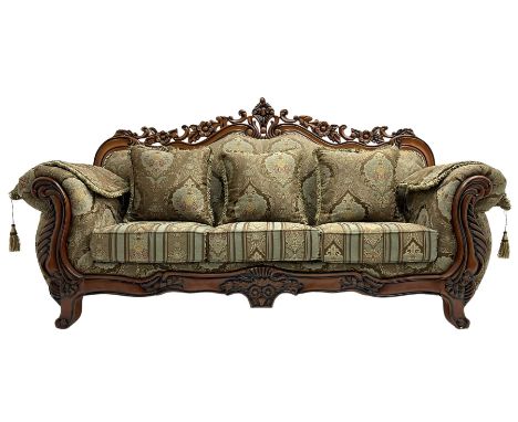 Italian Baroque design three seat sofa, hardwood framed, the cresting rail carved and pierced with c-scrolls and flower heads