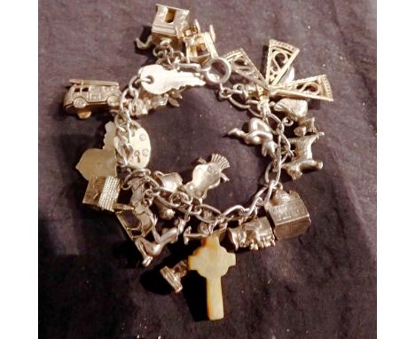 White metal charm bracelet with some silver charms. UK P&amp;P Group 1 (£16+VAT for the first lot and £2+VAT for subsequent l