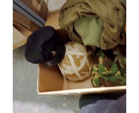 Box containing mixed military items including a cap, a helmet and military clothing. Not available for in-house P&amp;P