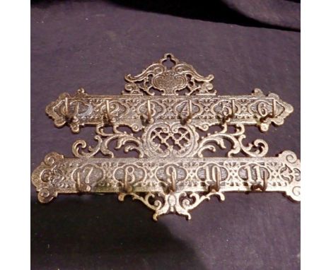 Cast iron key rack 11 hooks, L: 28 cm. UK P&amp;P Group 2 (£20+VAT for the first lot and £4+VAT for subsequent lots)
