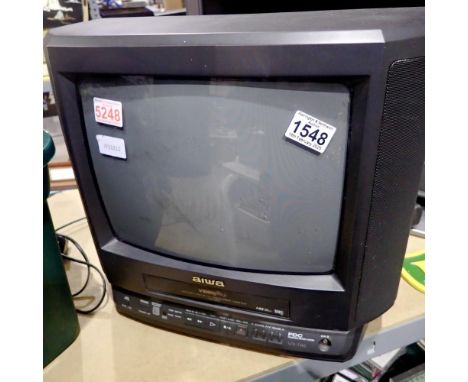 Aiwa 14 inch television and VHS plater, #VX-T145K, working. All electrical items in this lot have been PAT tested for safety 