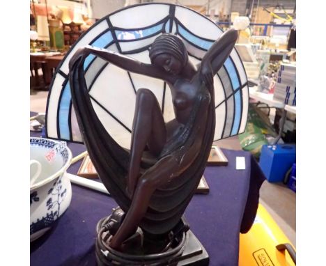 Resin figurine of an African lady with coloured glass panel as a lamp shade. All electrical items in this lot have been PAT t