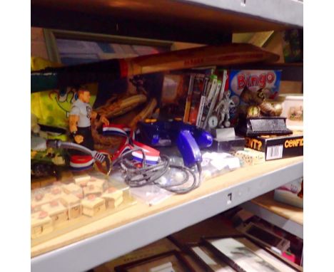 Shelf of mixed toys and games including Xbox 360/PSP/PlayStation 2 games. Not available for in-house P&amp;P 