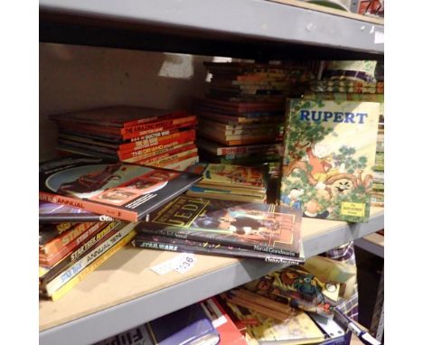 Shelf of mixed 1970s Star Wars, Star Trek, Dr Who and Rupert annuals. Not available for in-house P&amp;P