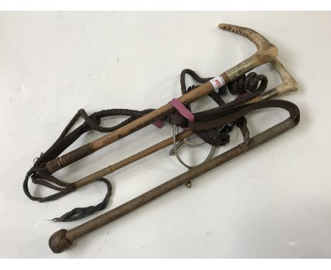 Three vintage riding crops / whips including a weighted example by Robson &amp; Cooper of York, together with a pair of spurs