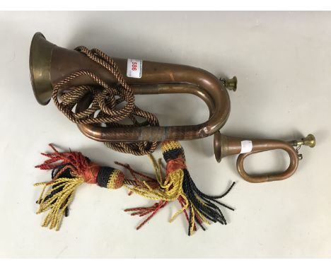 A brass bugle together with a miniature brass bugle