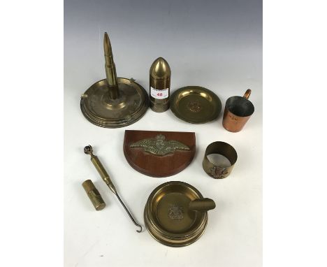 A quantity of trench art and military metalware including a Pusser's rum measure