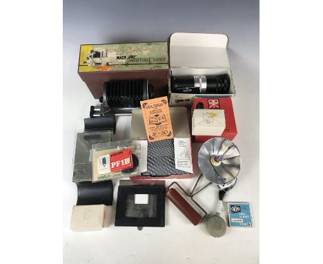 Vintage camera equipment, including a Panagor Zoom Slide Duplicator, Gepe glassless slide mounts, a Gnome lens flange, a Pate