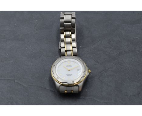 A gent's Citizen Eco Drive titanium wrist watch no: 7875-H01121TA having luminous baton numeral dial with date aperture and p