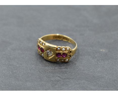 A small Victorian 18ct gold band ring having panel with diamond ruby and pearl decoration, size G/H &amp; approx 2.6g