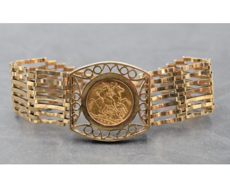 A 9ct gold seven bar gate bracelet with padlock clasp, having central panel holding a 1906 gold sovereign in a removable moun