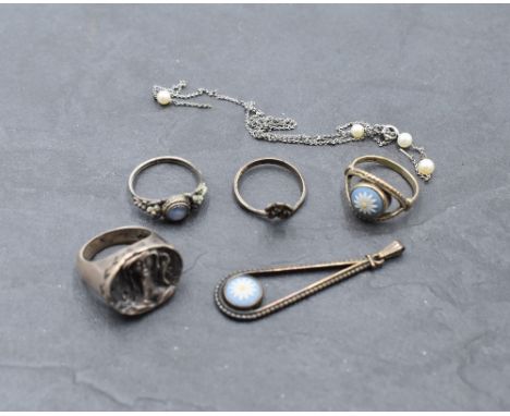 A small selection of white metal jewellery including an Artisan style ring with study of maiden, Wedgwood style HM silver pen