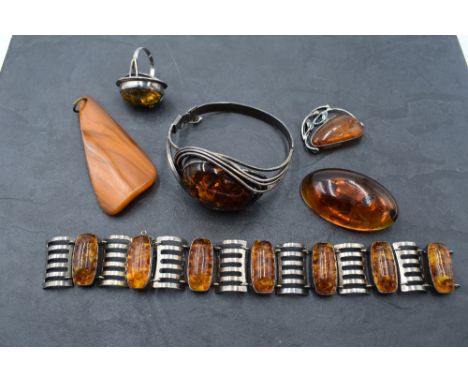 A selection of Baltic amber jewellery including white metal and amber hinged bangle stamped 925, ring, bracelet, brooch, brac