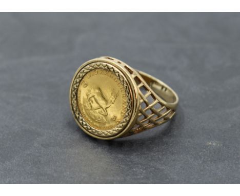 A 1/10 Krugerand dated 1984 in a 9ct gold removable ring mount, size U and approx 7.1g