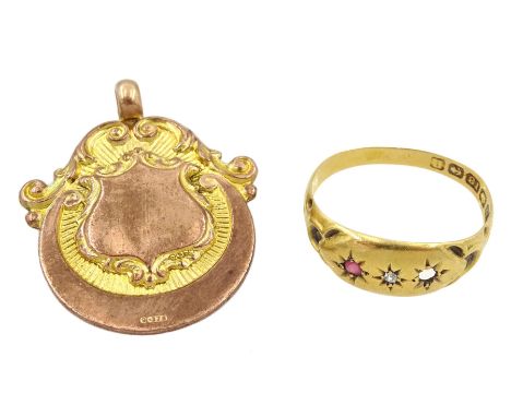 9ct rose gold fob medallion and an 18ct gold stone set ring, both hallmarkedCondition Report:18ct approx 1.6gm, one stone mis