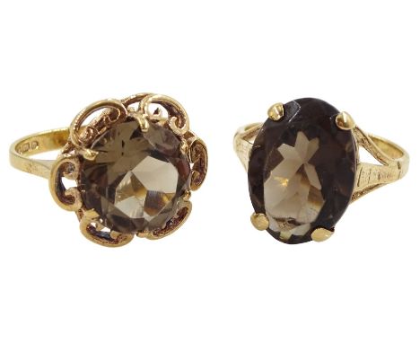 Two 9ct gold smokey quartz rings, both hallmarkedCondition Report:Approx 5.5gm, one size L, one size M-N, small bend to one s