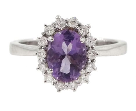 18ct white gold oval amethyst and round brilliant cut diamond cluster ring, hallmarkedCondition Report:Approx 4gm, size M-N, 