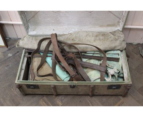 A travelling trunk containing sleeping roll, folding bed, campaign 'bucket and 'bowl' etc