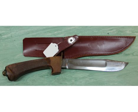 An 'R.J.H. jungle knife' by Wilkinson Sword London England complete with correct sheath, both knife and sheath in very good c