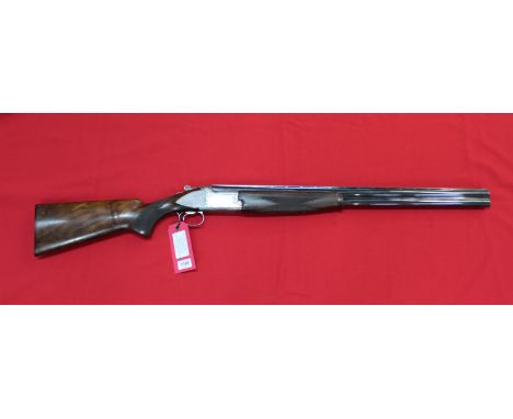 A Browning 12 bore over and under shotgun, this grade five example has 28" multi-choke barrels (only two chokes included), a 