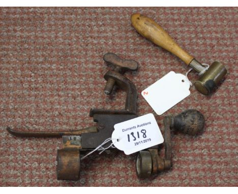 A shotgun 'turnover' tool (with pinfire) slot and a powder measure