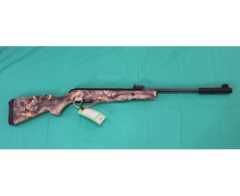 A Retay 702 .22 air rifle with 'camo' synthetic stock, 'as new' in original box, as a post 1939 air weapon the restrictions o