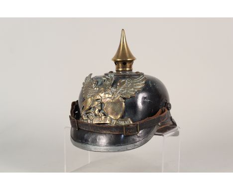 A 'German' pickelhaube with baden plate, in overall good condition but cockades missing