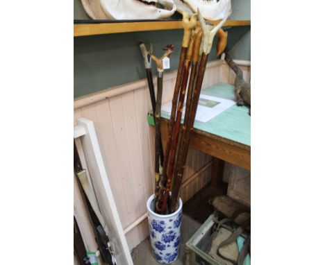 A collection of bespoke walking sticks with a shooting stick