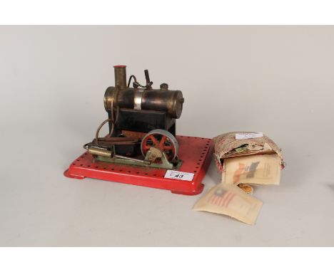 A Mamod stationary steam engine plus various cigarette card silks
