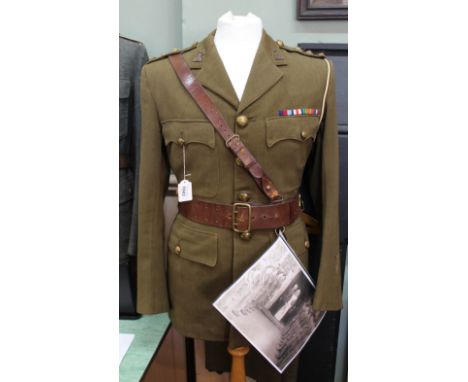 A WWII era Officers uniform including jacket, trousers, boots and Sam Browne, label in jacket reads "Hector Powe" Regent St L