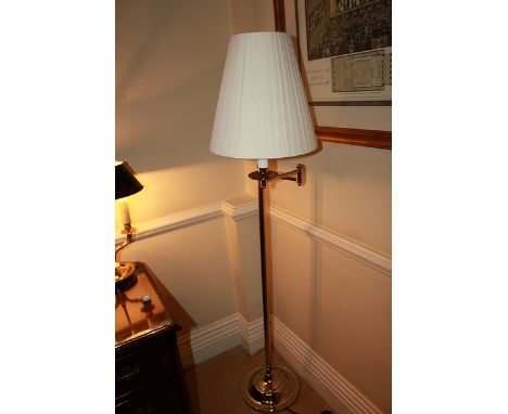 Contemporary silver metal adjustable swing arm floor lamp the angle of the lamp can be moved and positioned precisely by usin