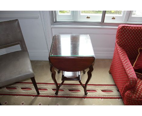 A mahogany lamp table with drop leaf sides mountedon bow legs 450mm x 450mm