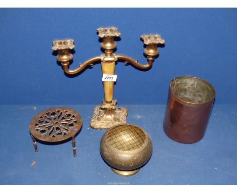 A copper pot, brass rose bowl, trivet and an alabaster/plated candelabra.