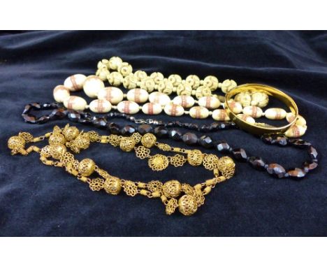Four necklaces and a 9 ct gold metal core bangle